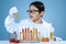 Young scientist looking at chemical fluid