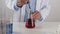Young Scientist Man Drop Solution in Erlenmeyer Flask and Stir to Mix in Lab