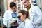 Young scientists carrying out an experiment in a laboratory.