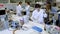 young scientists mixing reagents in test tube with lab pipette