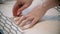 Young seamstress making marks using the soap and form