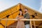 Young serene couple standing by glamping house and looking forwards