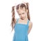 Young seven years old brunette girl in blue dress on a white iso