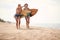 Young sexy female surfers enchanted by the sea