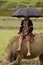 Young Shepherdess Hmong flower sitting on his buff