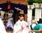 Young shinto priestess distributing good luck charms during Aoba festival