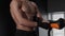 Young shirtless man boxer putting on boxing gloves