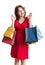 Young shopaholic woman is shopping with colorful bags.