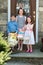 Young Siblings Outside Dressed Up for Easter holding Baskets