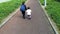 Young sister walks with her older sister to school