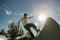 Young skateboarder flies with his board on the ramp of a skate park