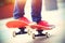 Young skateboarder legs riding on skateboard