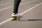 Young skateboarder riding skateboard at city stadium