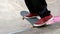 Young skateboarder skating the outdoor skatepark