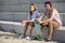 Young skateboarding couple on a beach