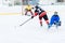 Young skater man in attack. Ice hockey game