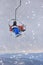 A Young Skier Enjoying the Thrills of Skiing on a Teleski in a Serene Mountain Setting Amidst Falling Snow