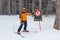 Young skier near a warning sign