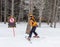 Young skier near a warning sign