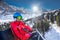 Young skier on ski lift in famous Ski resort in Swiss Alps, Jungfrau region, Switzerland