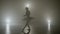 Young skinny graceful ballerina dancing on a dark stage as part of the audition for an a show -