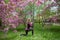 Young slender girl in sportswear goes in for sports in the park