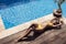Young slim beautiful woman in yellow bikini sunbathing