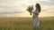 Young and slim pregnant girl dancing at sunset in slow motion.