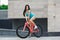 Young slim sportive woman on bicycle
