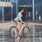 Young slim sportive woman on bicycle