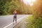 Young slim woman jogging in mountains. Rear view