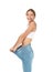 Young slim woman in old big jeans showing her diet results