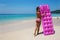 Young slim woman sunbath with air mattress on tropic beach