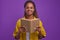 Young smart inquisitive African American woman student smiling holding book