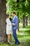 Young smiling bearded man and woman stand at big