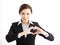 Young smiling business woman making heart shape