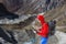 Young smiling Climber using smart Phone in high Mountains