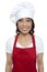 Young smiling female chef wearing red apron