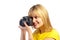 Young smiling girl with a dslr camera