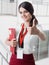 Young Smiling Girl Made Successful Work Shows Gesture Big Thumb Up. Beautiful Smiling Businesswoman Standing Against White Offices