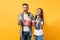 Young smiling laughing couple woman man watching movie film on date holding bucket of popcorn plastic cup of soda or