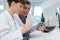 Young smiling man and woman experts checking wine quality