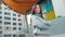 Young smiling professional business woman standing on street, portrait.