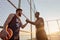 Young smiling sportsmen handshake on sports court