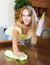 Young smiling woman dusting table