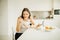 Young smiling woman eating cereal.Healthy breakfast.Starting your day.Dieting,fitness andmental health care.Positive energy and