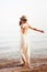 Young smiling woman enjoy summer holidays on a sea beach