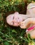 Young smiling woman on the grass