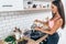 Young smiling woman preparing healthy breakfast. Diet, fitness and wellbeing.