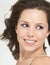 Young Smiling Woman with wind-swept hair close up